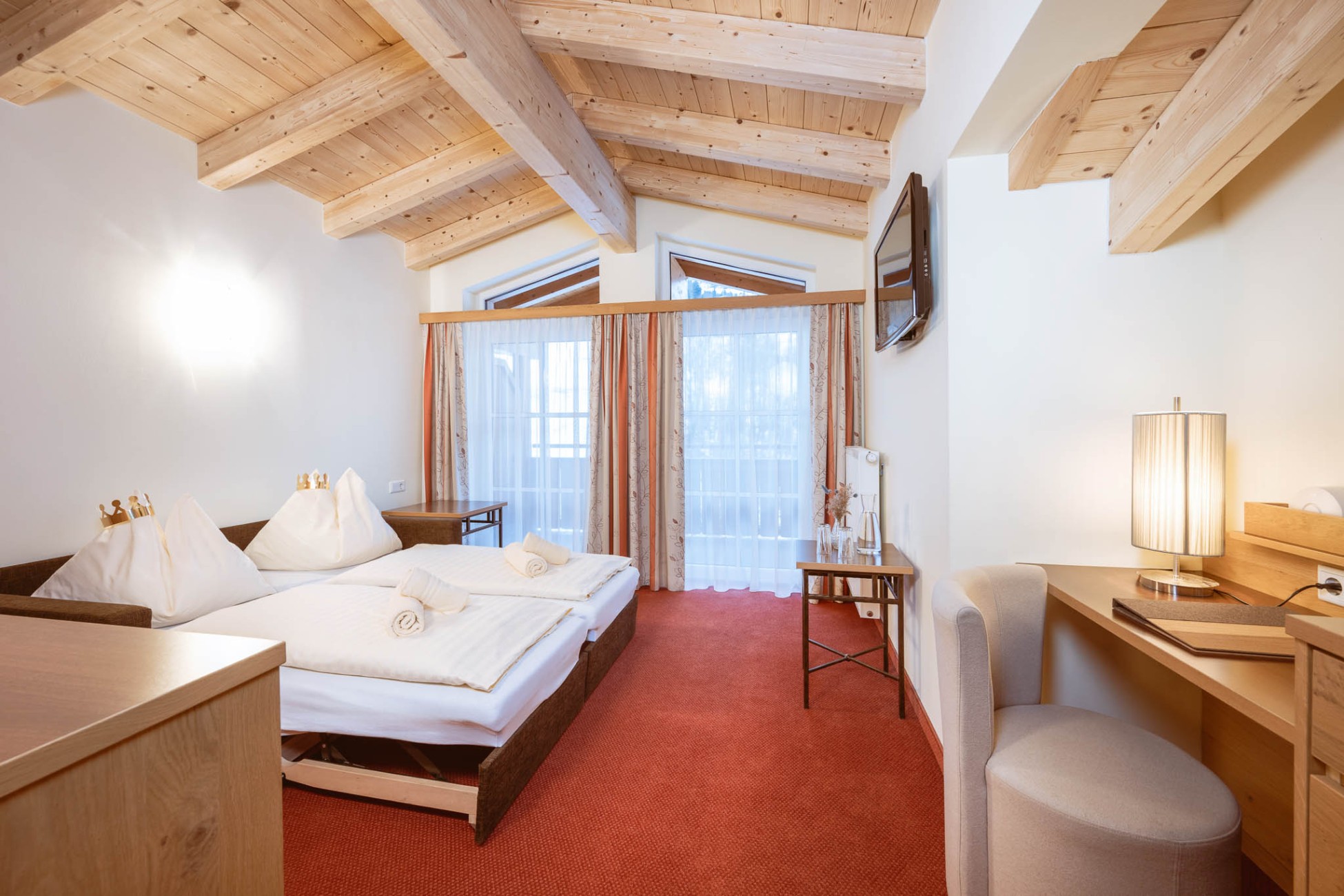 Schlafbereich der Juniosuite im Hotel Bachschmied.